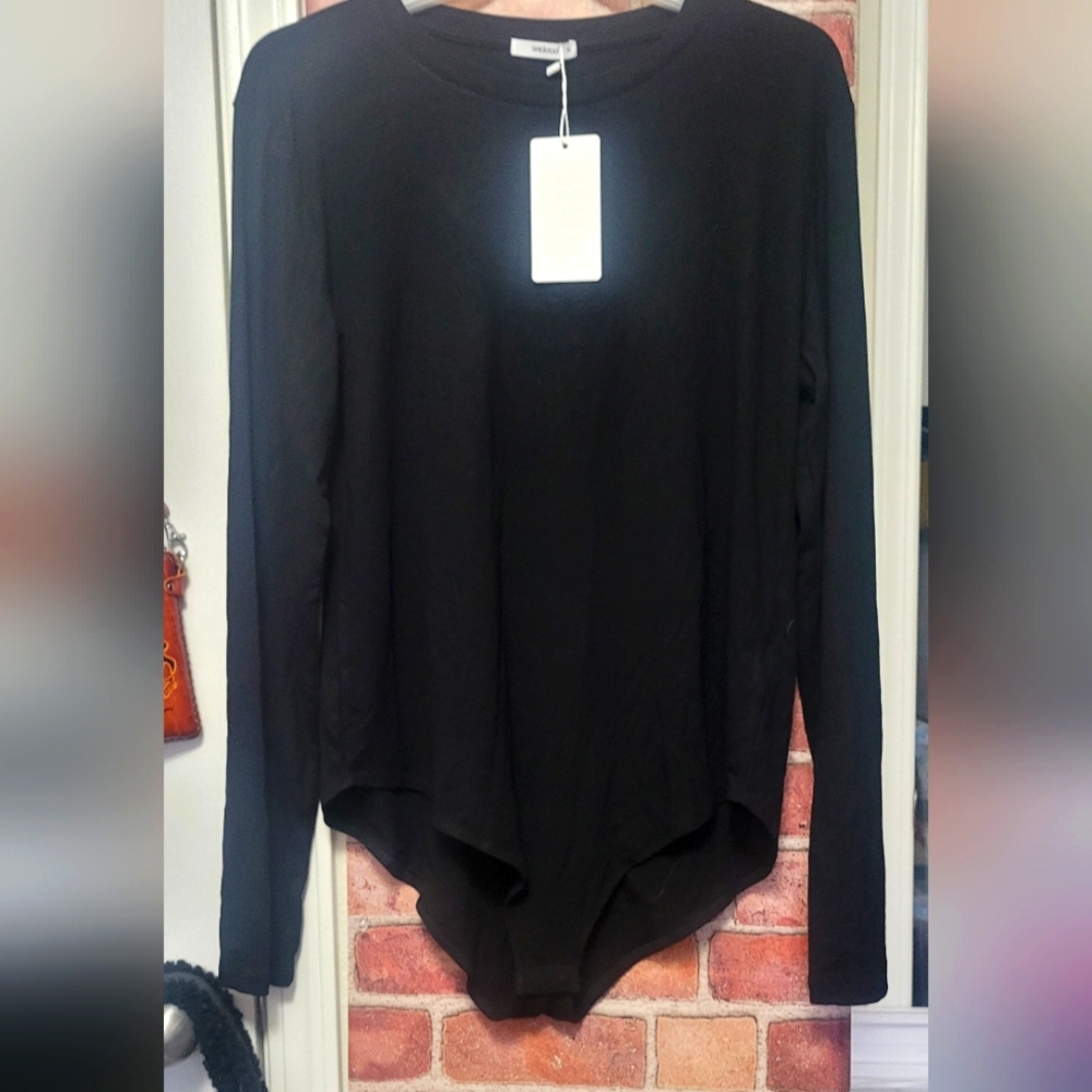 Women's plus size 3X black bodysuit. New with tags.